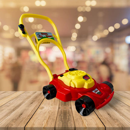Synx Tools rode gazonmaaier op houten tafel